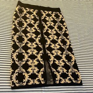 Back zipper pencil skirt with slit down the middle abaut 27”long